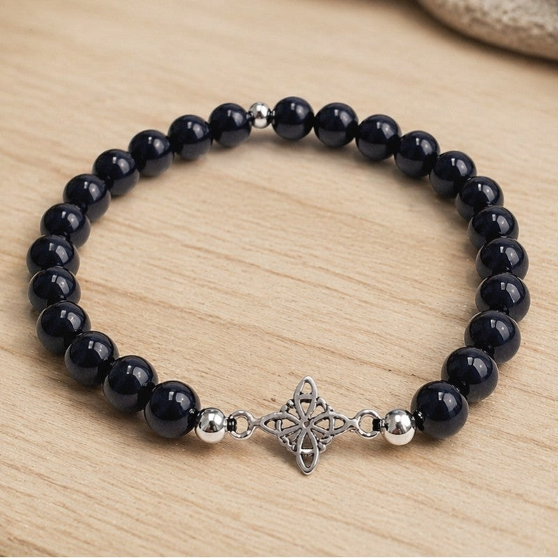 Pulsera de ónix con símbolo nudo de brujas en plata (6 mm)