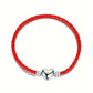 PULSERA DE CUERO ARTESANA ROJA CON DIJE DE CORAZÓN
