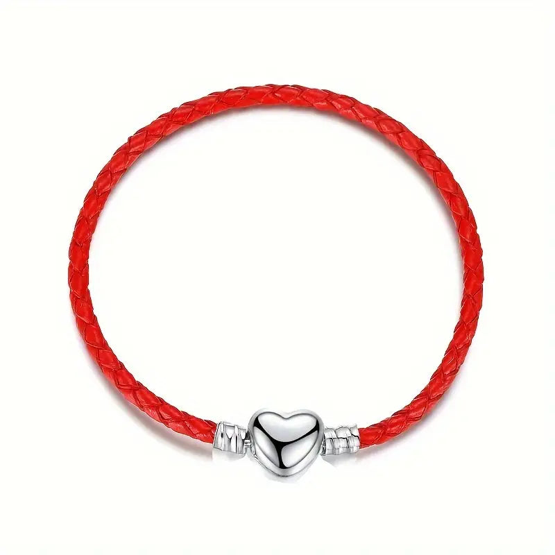 PULSERA DE CUERO ARTESANA ROJA CON DIJE DE CORAZÓN