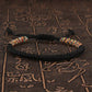 PULSERA TRENZADA  BUDISTA CON DETALLE DE HILO MULTICOLOR