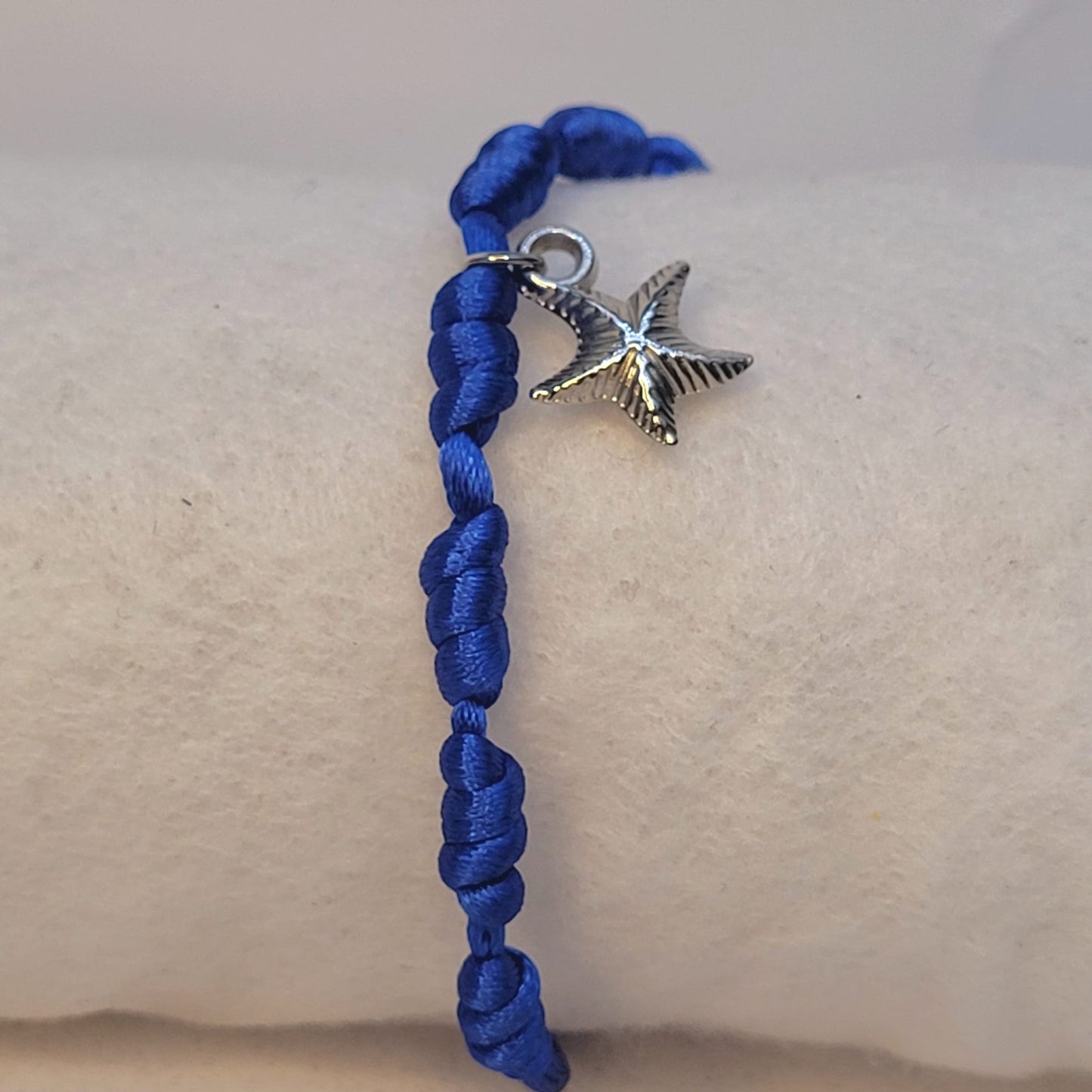 PULSERA AZUL 7 NUDOS CON ESTRELLA DE MAR