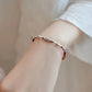 PULSERA DE HILO TRENZADA CON DIJE DE PEZ DE VIDA
