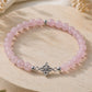 Pulsera de cuarzo rosa con nudo de brujas de plata – Amor y protección