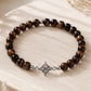 Pulsera ojo de tigre · Nudo de brujas en plata (6 mm)